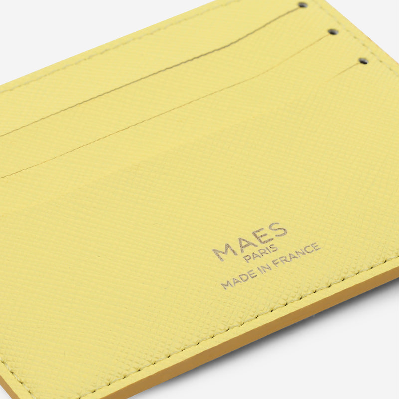 Porte-cartes M24 de MAES Paris, fabriqué en France en M_MAT_mycelium, zoom sur le logo [color:jaune saffiano,saffiano yellow]